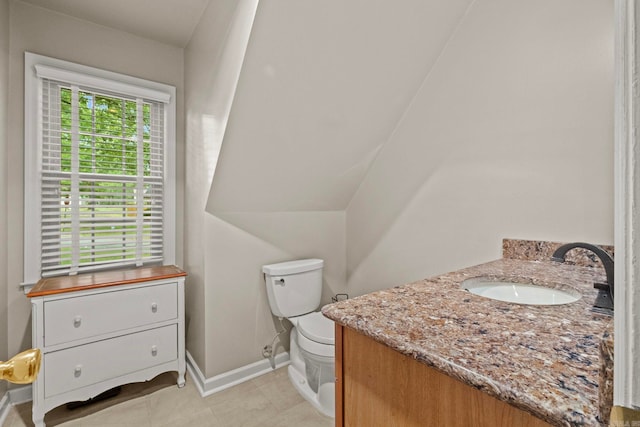 bathroom with vanity, toilet, and tile patterned flooring