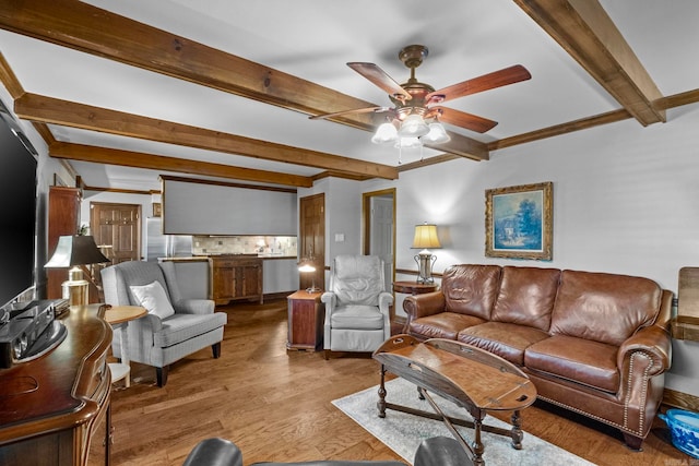 living room with light hardwood / wood-style floors, crown molding, beam ceiling, and ceiling fan