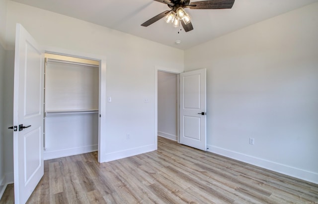 unfurnished bedroom featuring light hardwood / wood-style flooring, a closet, and ceiling fan