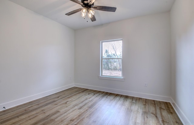 spare room with ceiling fan and light hardwood / wood-style flooring