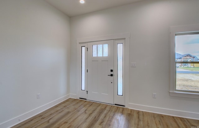 entryway with light hardwood / wood-style floors