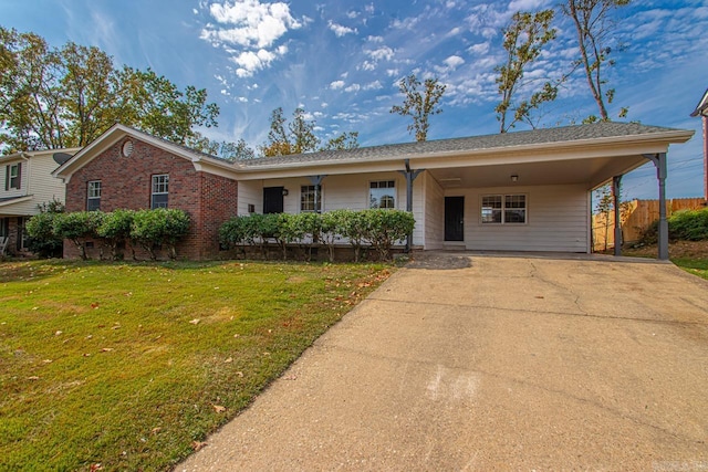 single story home with a carport and a front lawn