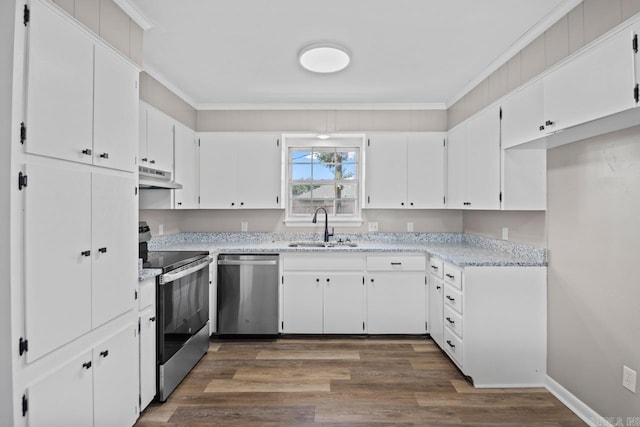 kitchen featuring dark wood-type flooring, sink, crown molding, white cabinetry, and appliances with stainless steel finishes