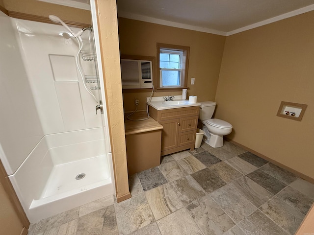 bathroom with crown molding, vanity, toilet, and a shower