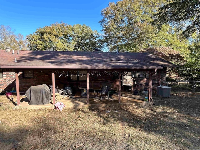 view of outbuilding featuring central AC and a lawn