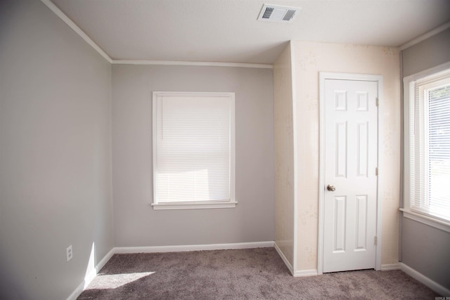 unfurnished bedroom featuring carpet and ornamental molding