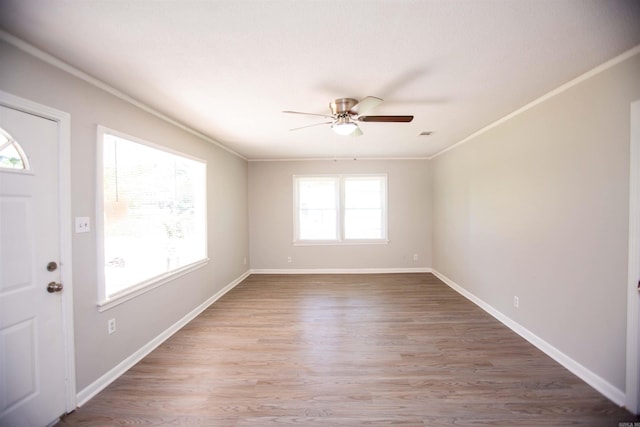 foyer with crown molding, hardwood / wood-style floors, and ceiling fan