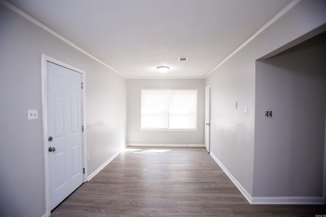 corridor with crown molding and wood-type flooring