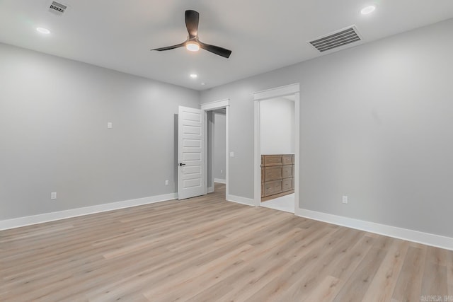 unfurnished bedroom with ensuite bathroom, light hardwood / wood-style flooring, and ceiling fan