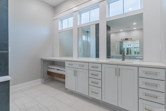 bathroom with walk in shower and vanity