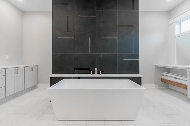 bathroom featuring a bathing tub and vanity