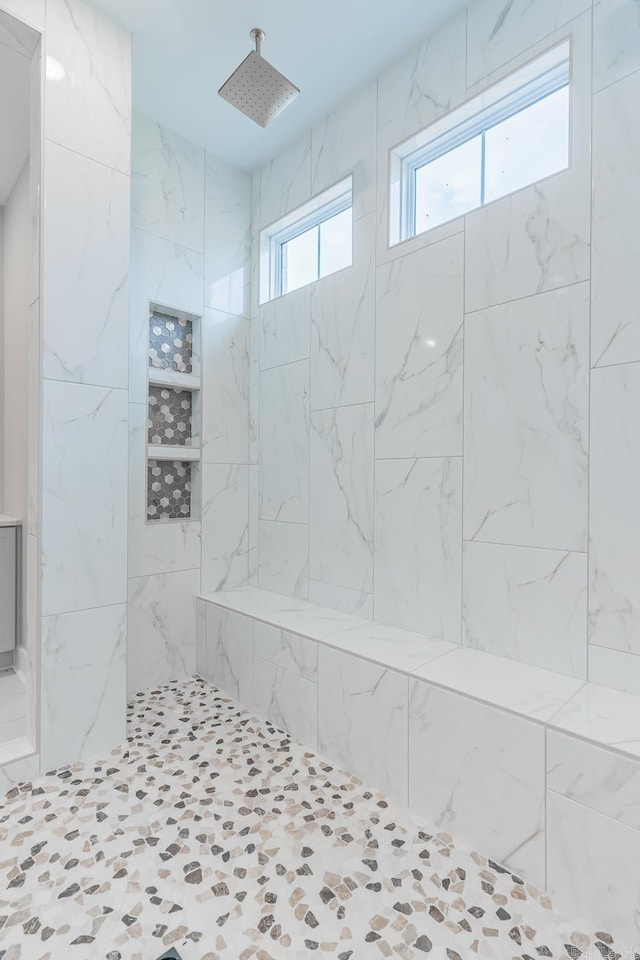 bathroom featuring tiled shower