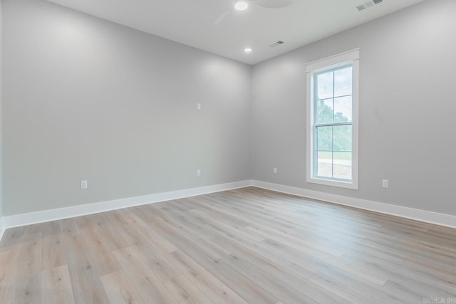 unfurnished room with light hardwood / wood-style flooring and ceiling fan