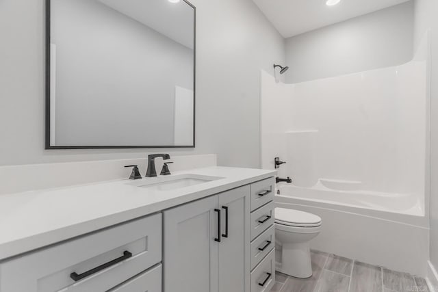 full bathroom with toilet, vanity, and bathing tub / shower combination