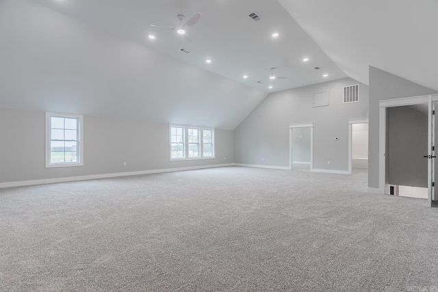 bonus room featuring ceiling fan, light colored carpet, and lofted ceiling