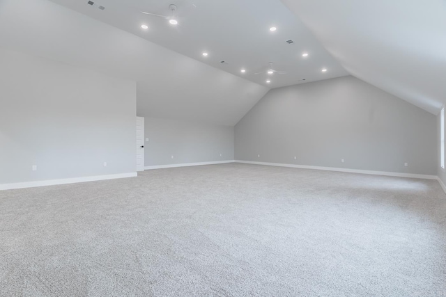 bonus room featuring light carpet and vaulted ceiling