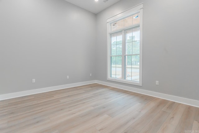 spare room featuring light wood-type flooring