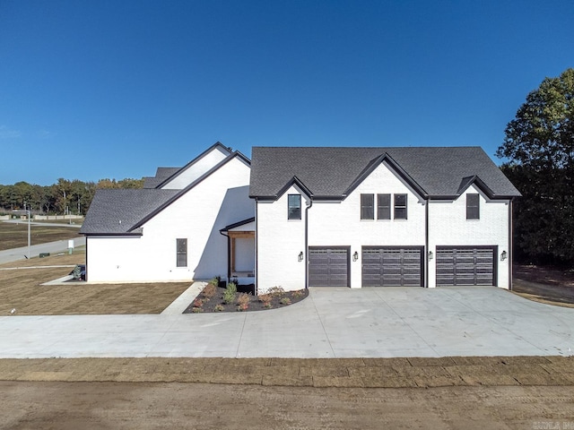 modern farmhouse with a garage