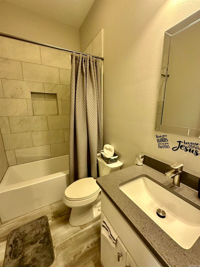 full bathroom featuring hardwood / wood-style floors, vanity, shower / bathtub combination with curtain, and toilet