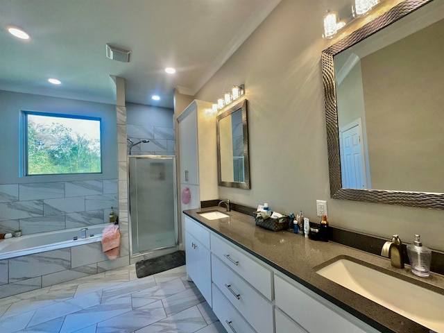 bathroom with vanity, separate shower and tub, and ornamental molding