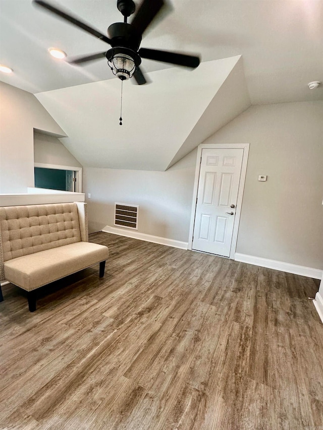 bonus room with hardwood / wood-style floors, ceiling fan, and vaulted ceiling