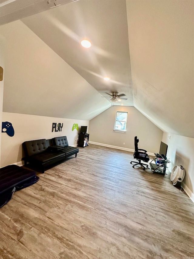 bonus room with lofted ceiling, hardwood / wood-style flooring, and ceiling fan