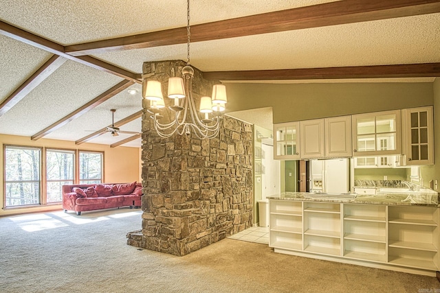 living room with a textured ceiling, vaulted ceiling with beams, sink, ceiling fan with notable chandelier, and light colored carpet