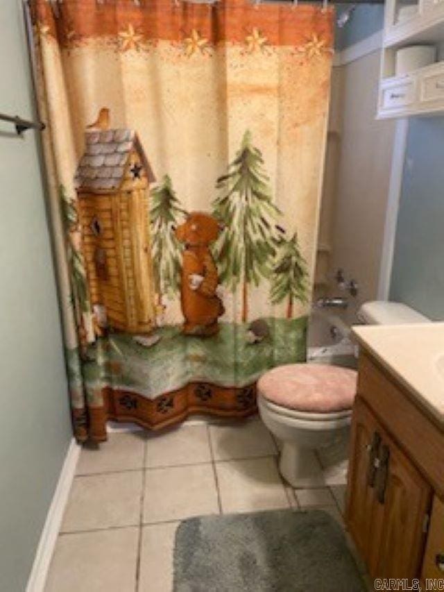 full bathroom with tile patterned flooring, vanity, toilet, and shower / tub combo with curtain