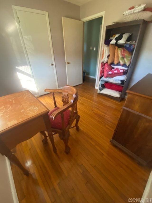 living area with hardwood / wood-style flooring