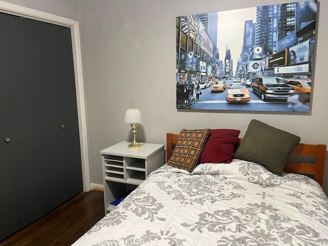 bedroom featuring dark hardwood / wood-style flooring