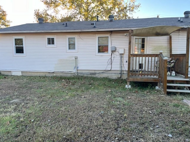 rear view of house featuring a deck