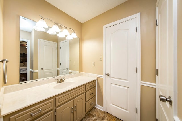 bathroom with vanity and a textured ceiling