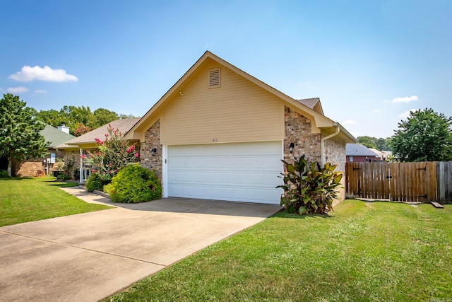 view of front facade featuring a front yard and a garage