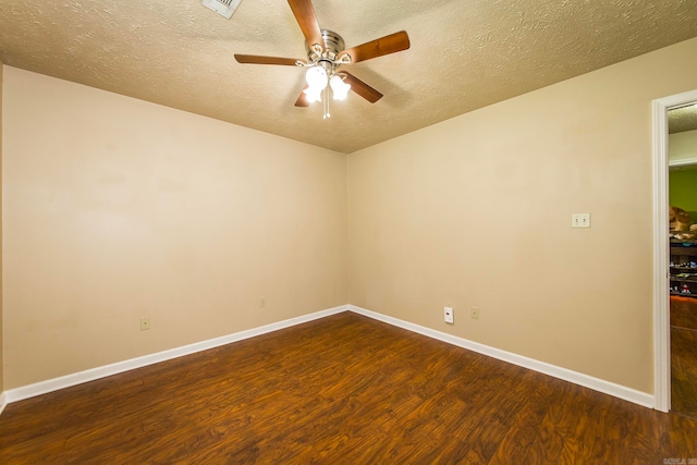 unfurnished room with dark wood-type flooring, ceiling fan, and a textured ceiling