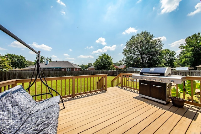 wooden terrace with a lawn