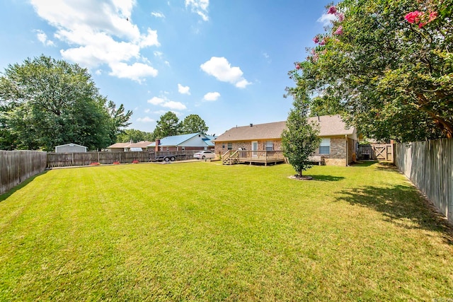 view of yard featuring a deck