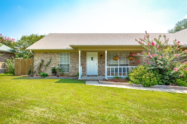 single story home featuring a front yard and a porch