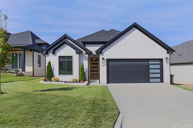 view of front of house with a front lawn and a garage