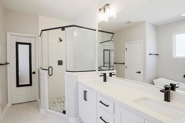 bathroom with vanity, tile patterned floors, and an enclosed shower