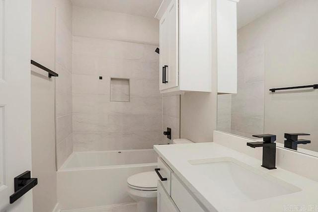 full bathroom with vanity, toilet, and tiled shower / bath combo