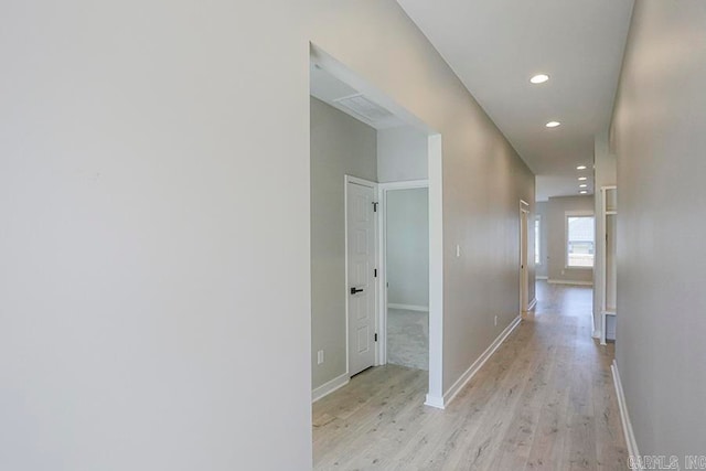 hall with light hardwood / wood-style floors