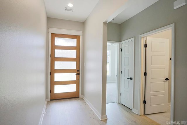 foyer with light hardwood / wood-style flooring