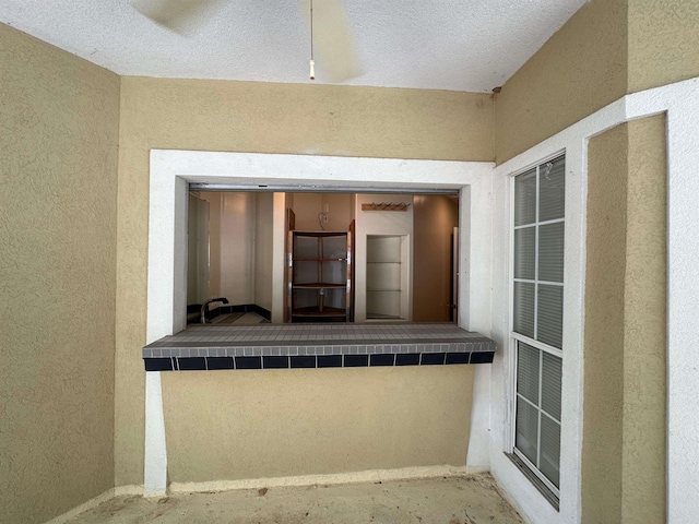 exterior space featuring a textured ceiling