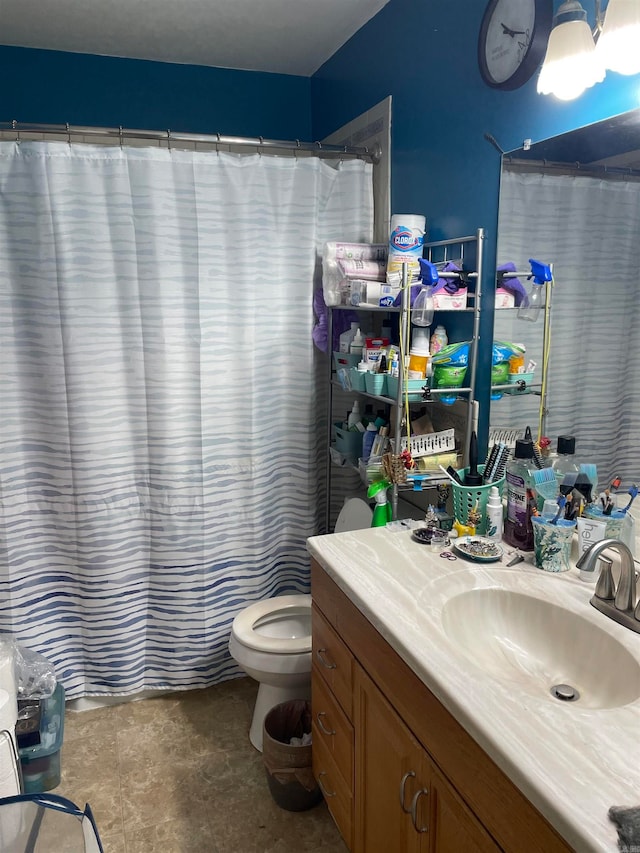 bathroom featuring vanity, toilet, and a shower with curtain