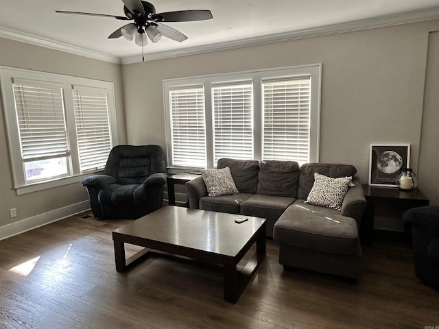 living room with dark wood-type flooring, crown molding, and ceiling fan