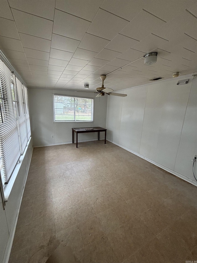 2205 W 34th Ave, Pine Bluff, AR 71603 - unfurnished room featuring a ceiling fan, baseboards, and tile patterned floors