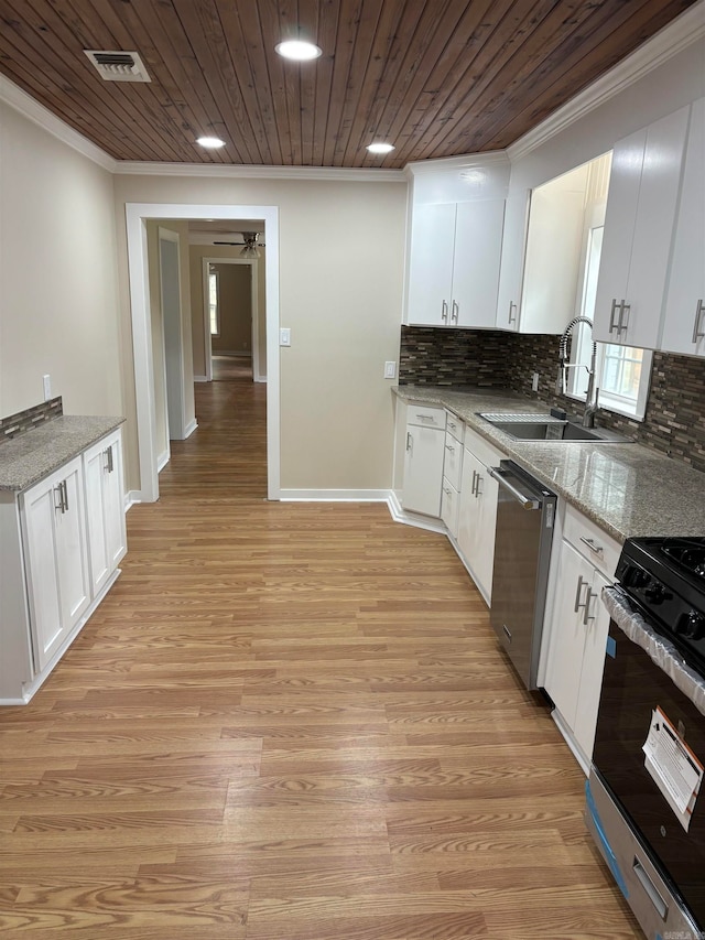 kitchen with white cabinetry, light hardwood / wood-style floors, stainless steel appliances, and sink