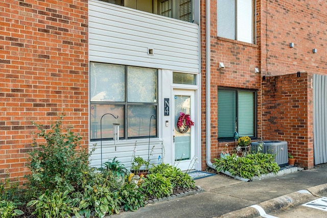 doorway to property featuring cooling unit