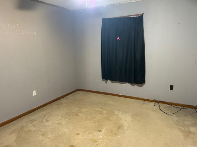 empty room featuring carpet flooring