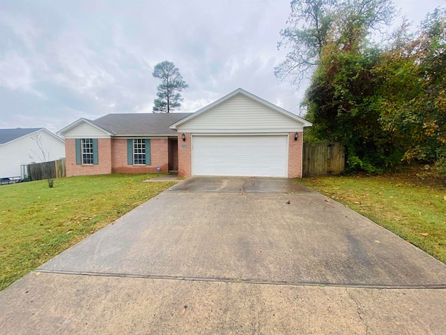 single story home with a garage and a front lawn